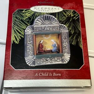 Hallmark Keepsake Ornament - A Child Is Born Silver